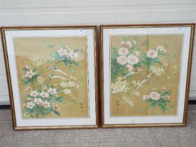 A pair of Chinese gouache paintings of birds perched amongst flowering shrubs, signed by the artist,