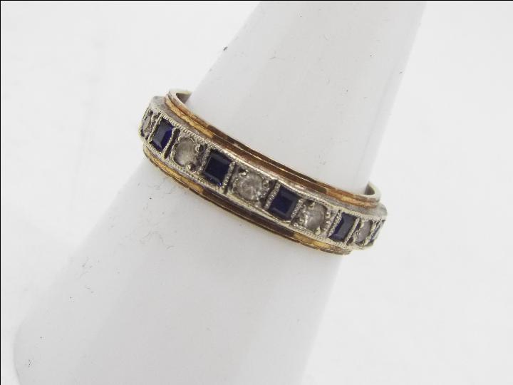 A 9ct gold sapphire and white stone eternity ring, size O , approximately 3.8 grams.