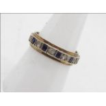 A 9ct gold sapphire and white stone eternity ring, size O , approximately 3.8 grams.