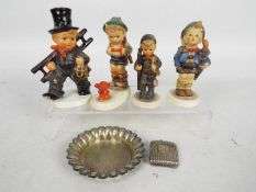 Four Goebel / Hummel figurines including two chimney sweeps and a plated dish and vesta case.