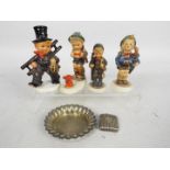 Four Goebel / Hummel figurines including two chimney sweeps and a plated dish and vesta case.