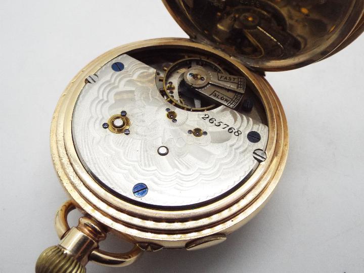 A gold plated, open faced pocket watch with Roman numerals and centre seconds, 5.5 cm case diameter. - Image 5 of 5