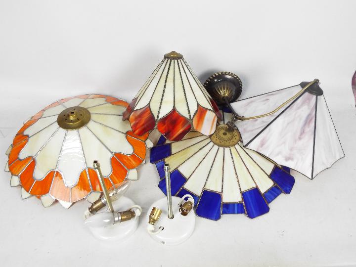 A collection of Tiffany style ceiling lights / shades, largest approximately 45 cm (d).