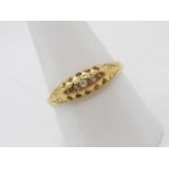 An 18ct yellow gold stone set ring (2 stones deficient), size R, approximately 1.9 grams.