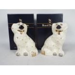 A boxed pair of Royal Doulton Staffordshire style seated spaniels, approximately 19 cm (h).
