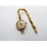 A lady's 9ct gold cased wrist watch on expanding bracelet stamped 9ct (bracelet A/F),