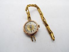 A lady's 9ct gold cased wrist watch on expanding bracelet stamped 9ct (bracelet A/F),