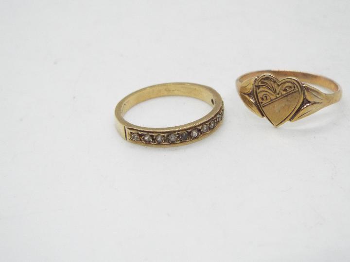 A 9ct gold heart ring, size M and a yellow metal half eternity ring, size K, stamped 9ct, - Image 2 of 4