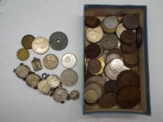 A small collection of UK and foreign coins and a coin bracelet.