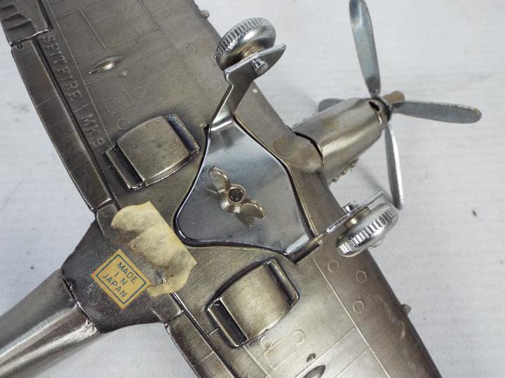 A novelty table lighter in the form of a Supermarine Spitfire Mk IX, 20 cm (l). - Image 6 of 6