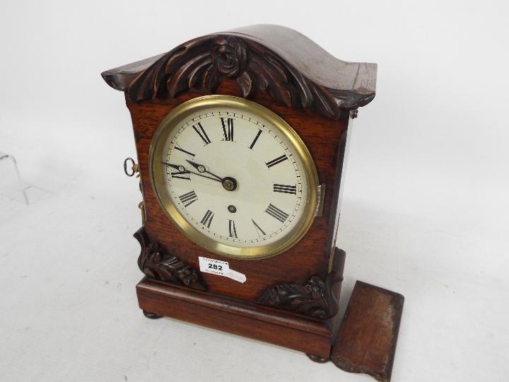 A mid-Victorian mantel clock, mahogany case with arched top and applied, - Image 3 of 5