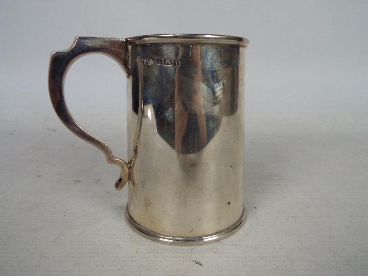 A George VI silver tankard, Birmingham assay 1943, sponsors mark for Thomas Ducrow & Sons,