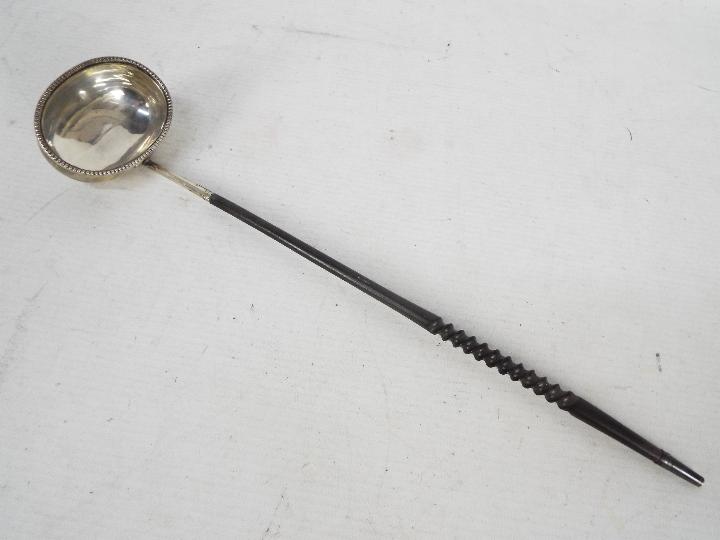 A silver toddy ladle, 35 cm (l) Condition Report: Generally good condition,