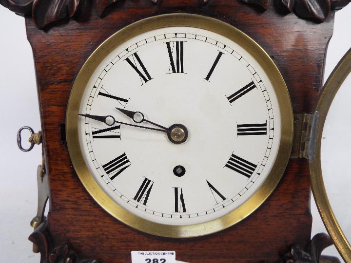 A mid-Victorian mantel clock, mahogany case with arched top and applied, - Image 2 of 5