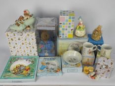 A collection of boxed items relating to Beatrix Potter and Winnie The Pooh including Wedgwood,
