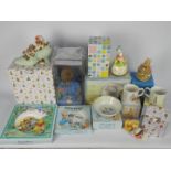 A collection of boxed items relating to Beatrix Potter and Winnie The Pooh including Wedgwood,