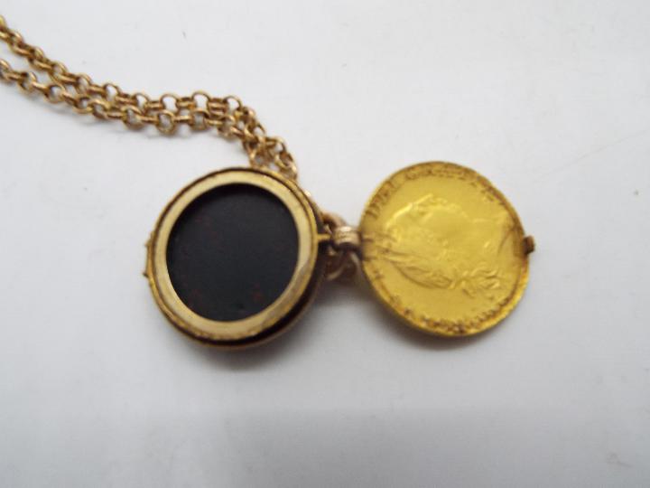 An interesting locket, the front hinged face formed from a George III spade guinea, 1788, - Image 3 of 3