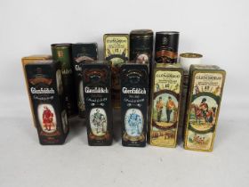 A quantity of vintage whisky presentation tins / tubes, all empty,