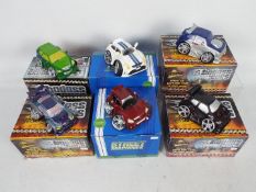 A collection of boxed Street Machines and Badass Cars model cars.