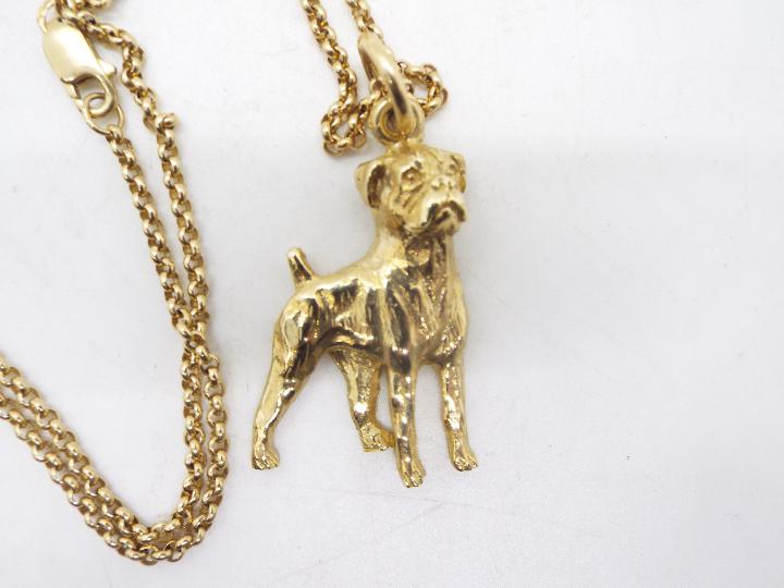 A 9ct gold pendant in the form of a boxer dog on a 9ct gold necklace, 44 cm (l), approximately 12. - Image 2 of 3