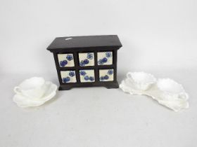 Lot to include a small wooden cabinet with six blue and white ceramic drawers,