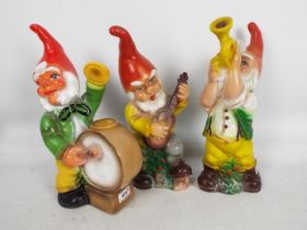 Garden Gnomes - A group of 3 plastic garden gnomes with musical instruments.