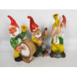 Garden Gnomes - A group of 3 plastic garden gnomes with musical instruments.