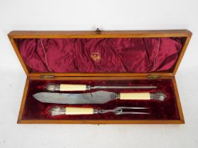 A Victorian silver mounted, three piece carving set contained in fitted case, Sheffield assay 1892.