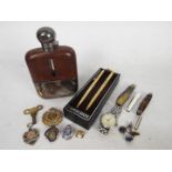 A mixed lot of collectables to include white metal hip flask, penknives, wrist watch,