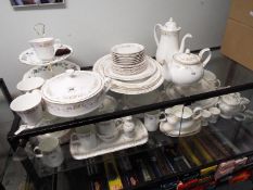 A collection of dinner and tea wares to include Mayfair Fine Bone China, approximately 80 pieces.