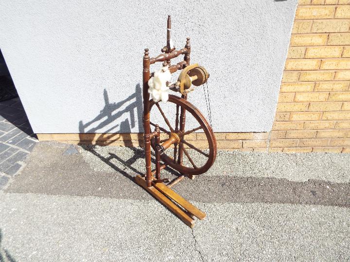 A late 19th or early 20th century spinning wheel, height 101 cm and wheel diameter 54 cm. - Image 2 of 3