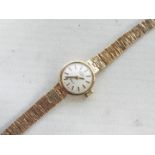 A lady's 9ct gold cased wrist watch with 9ct bracelet, 14.2 grams all in.