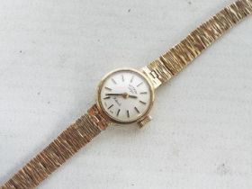 A lady's 9ct gold cased wrist watch with 9ct bracelet, 14.2 grams all in.