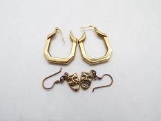 A pair of 9ct yellow gold earrings and a pair of yellow metal earrings in the form of Melpomene and