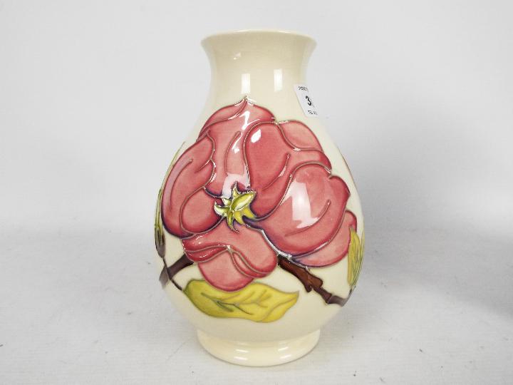 Moorcroft Pottery - a large vase of bulbous form tubelined and hand painted with pink magnolia on a - Image 4 of 5