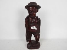 Withdrawn - Ethnographica - An African hardwood caring depicting a fisherman,