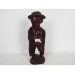 Withdrawn - Ethnographica - An African hardwood caring depicting a fisherman,