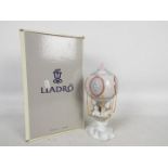 A boxed Lladro figural group entitled Through The Clouds, # 6522,