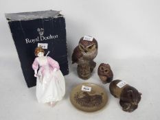 Poole Pottery and Royal Doulton - a group of four comprising a large owl, 18cm (h),