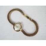 A lady's 9ct gold cased wrist watch on 9ct gold bracelet, 19.1 grams all in.