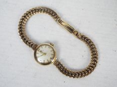 A lady's 9ct gold cased wrist watch on 9ct gold bracelet, 19.1 grams all in.