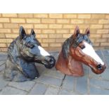 Two painted, reconstituted stone, horse head garden ornaments, approximately 48 cm (h).