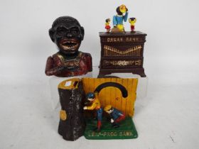 A vintage cast iron Jolly Bank and two further cast iron money banks comprising Organ Bank and Leap