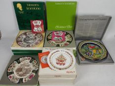 A collection of boxed Christmas Plates c