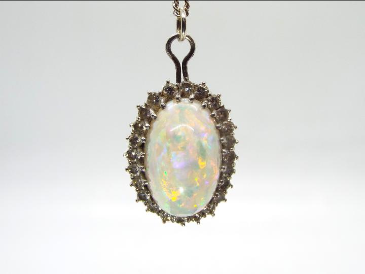 18ct gold - A white metal, opal and diam