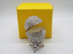 A crystal encrusted egg form trinket box