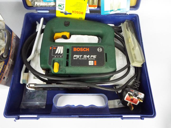 A Bosch jigsaw in carry case and a Power Craft angle grinder. - Image 2 of 3