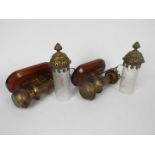 A pair of brass candle lamps bearing pla