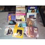 A collection of vinyl records, various artists.