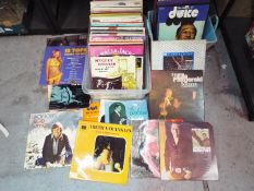 A collection of vinyl records, various artists.